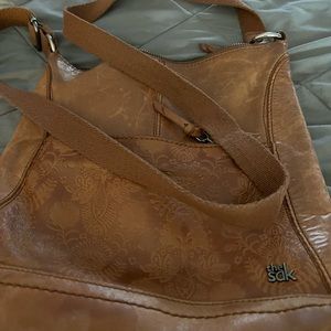The Sac leather body crossbody purse lots of storage